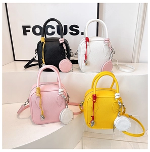 Showcase of minimalist square crossbody bags in black, white, pink, and yellow colors