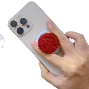 Universal round magnetic phone socket featuring vibrant red glitter finish and collapsible grip
