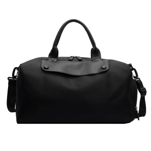 Large black Oxford travel bag with leather accents, dual handles and adjustable strap