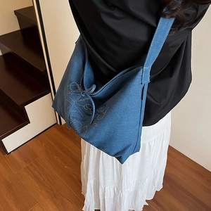 Large capacity dark blue denim tote bag with rhinestone lettering and bow detail