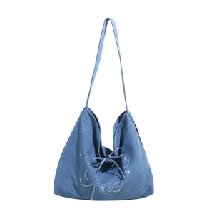 Blue denim tote bag with Good rhinestone lettering and stylish bow shoulder strap