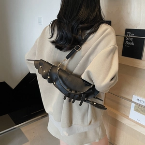 Unique black lobster shaped crossbody bag with gold rivets and adjustable strap