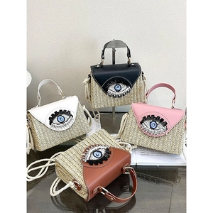 French style straw handbags with embroidered eyes and pearl details in four colors