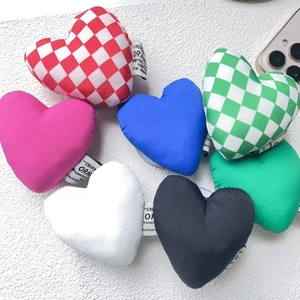 Detail of colorful plush heart-shaped magnetic phone stands with Creative Ornament tags