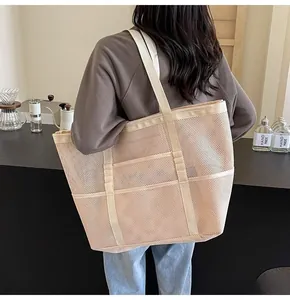 Mesh tote bag showing large capacity and breathable net material on shoulder