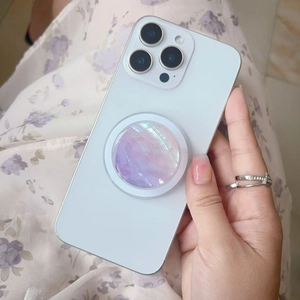 Detailed close-up of a pearlescent shell texture phone socket with soft gradient colors