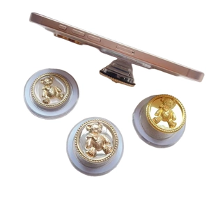 Metallic bear folding phone grip and magnetic stand with electroplated finish on white background