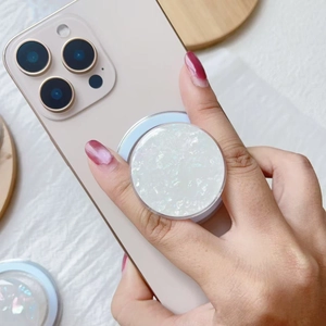 Iridescent white shell pattern MagSafe magnetic phone socket holder on a smartphone
