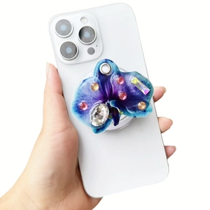 Detail of magnetic orchid phone grip with blue gradient petals and crystal rhinestones