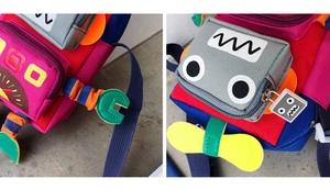 Vue détaillée du sac robot coloré avec bras 3D et coutures multicolores contrastées