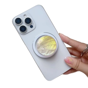 Gradient shell texture magnetic folding phone socket stand on a white smartphone