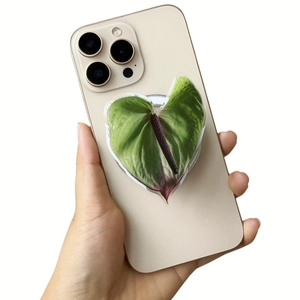 Close-up of heart-shaped green leaf magnetic phone grip holder with natural texture