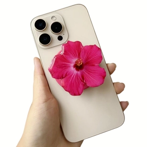 Pink floral acrylic magnetic phone grip holder on a smartphone with a retractable design