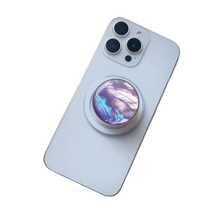 Universal circular phone grip with gradient purple shell texture on white smartphone