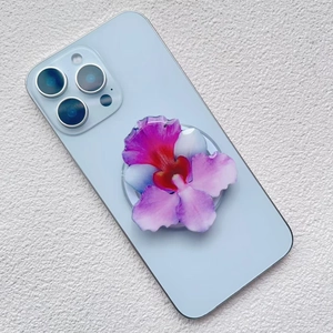 Close-up of a 3D orchid flower magnetic phone grip with gradient purple and blue petals
