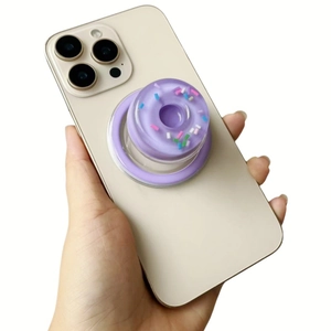 Detailed view of a purple donut phone socket with colorful sprinkles on a phone