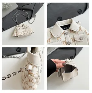 Macro detail of white jacket-shaped mini bag with textured leather and chain strap