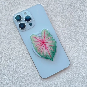 Detail of leaf-shaped phone grip with pink and green caladium vein patterns