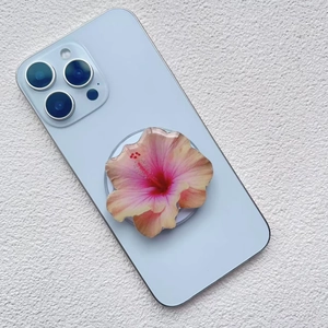 Detailed macro view of 3D pink-orange gradient floral phone socket on blue smartphone