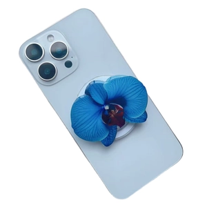 Blue orchid magnetic phone socket stand with realistic flower petals on blue smartphone