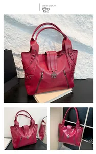 Détail du sac cabas bordeaux avec texture de litchi et ornements en métal fleuri