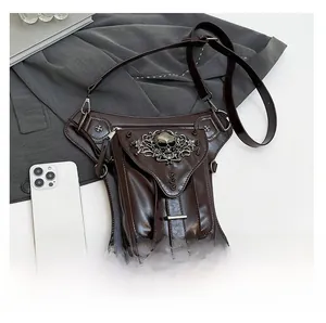 Detail view of steampunk thigh bag with skull embossment and adjustable metal buckle straps