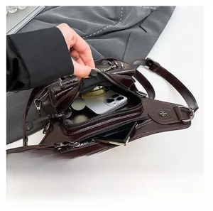 Detailed interior of punk waist bag showing space for phone and small essentials