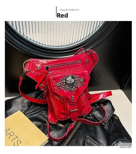 Detail of red steampunk waist leg bag with skull emblem and glossy riveted texture