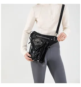 Macro detail of steampunk leg bag featuring silver skull relief and black patent leather