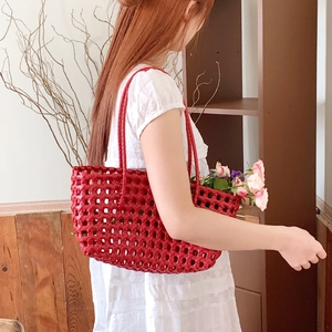 Fashionable red woven tote bag with cutout grid design and double handles for women