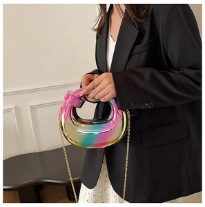 Iridescent acrylic clutch with golden chain strap for elegant party and evening wear