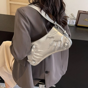 Silver metallic baguette bag with claw embossed design and adjustable shoulder strap