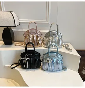 Chic ruched motorcycle bags in metallic shades with pearl bows and heart charms
