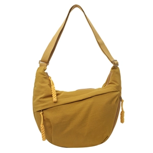 Mustard yellow nylon crescent crossbody bag with adjustable strap and zip details
