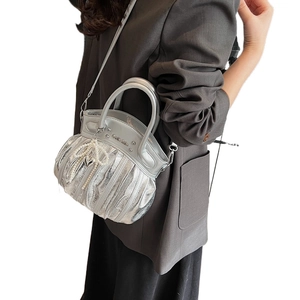 Silver pleated shoulder bag with pearl heart charm and adjustable strap for women