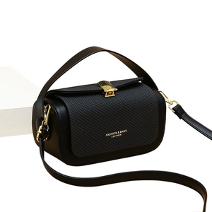 Classic black woven texture box bag with gold scallop clasp and leather strap
