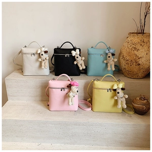 Group of small square leather bags in five colors with cute plush puppy charms