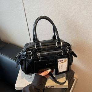 Luxury black retro Boston handbag with multi-zippers and adjustable shoulder strap