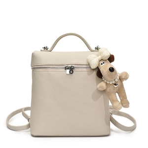 Chic beige lychee leather backpack with a cute plush puppy pendant and metal zippers