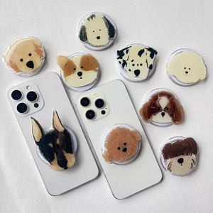 Detailed flat lay of cute hand-drawn dog portrait Griptok phone stands on a white surface