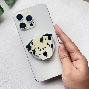 Close-up of cute acrylic Dalmatian dog popsocket stand attached to a white smartphone