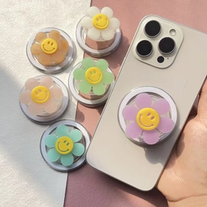 Detail of flower smile magnetic phone grip showing multiple colors on mobile device