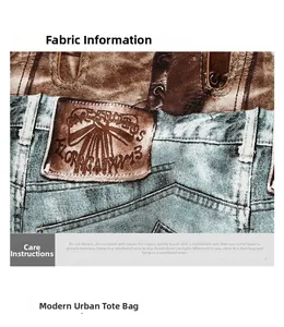 Close-up of vintage tote bag showing texture of brown leather and blue denim patchwork