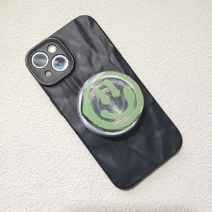Close-up of wavy texture phone case with light green smiley face expandable socket
