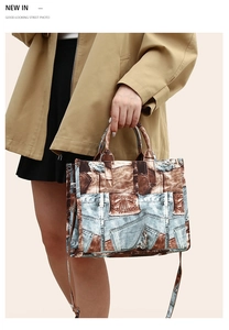 Detail of vintage patchwork tote bag with denim print and adjustable shoulder straps