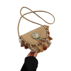 Bohemian woven straw crossbody bag with colorful tassels and mandala detailing