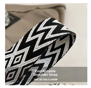 Close-up of thick black and white geometric woven strap with high-density texture