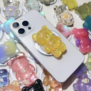 Collage of colorful bear shape phone grips with sparkling gold leaf in various shades