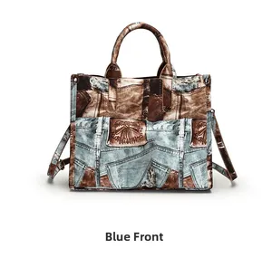 Front view of vintage patchwork denim tote bag with brown leather accents and straps