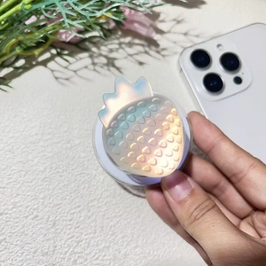 Iridescent strawberry phone socket holder with textured finish and pop-up stand